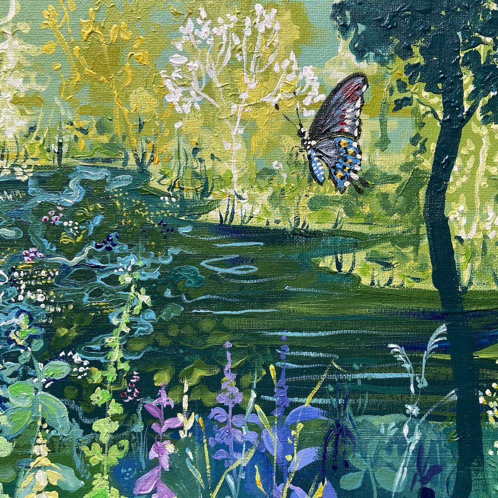 Close-up of a butterfly beside a tree trunk in The Forest of Dreams