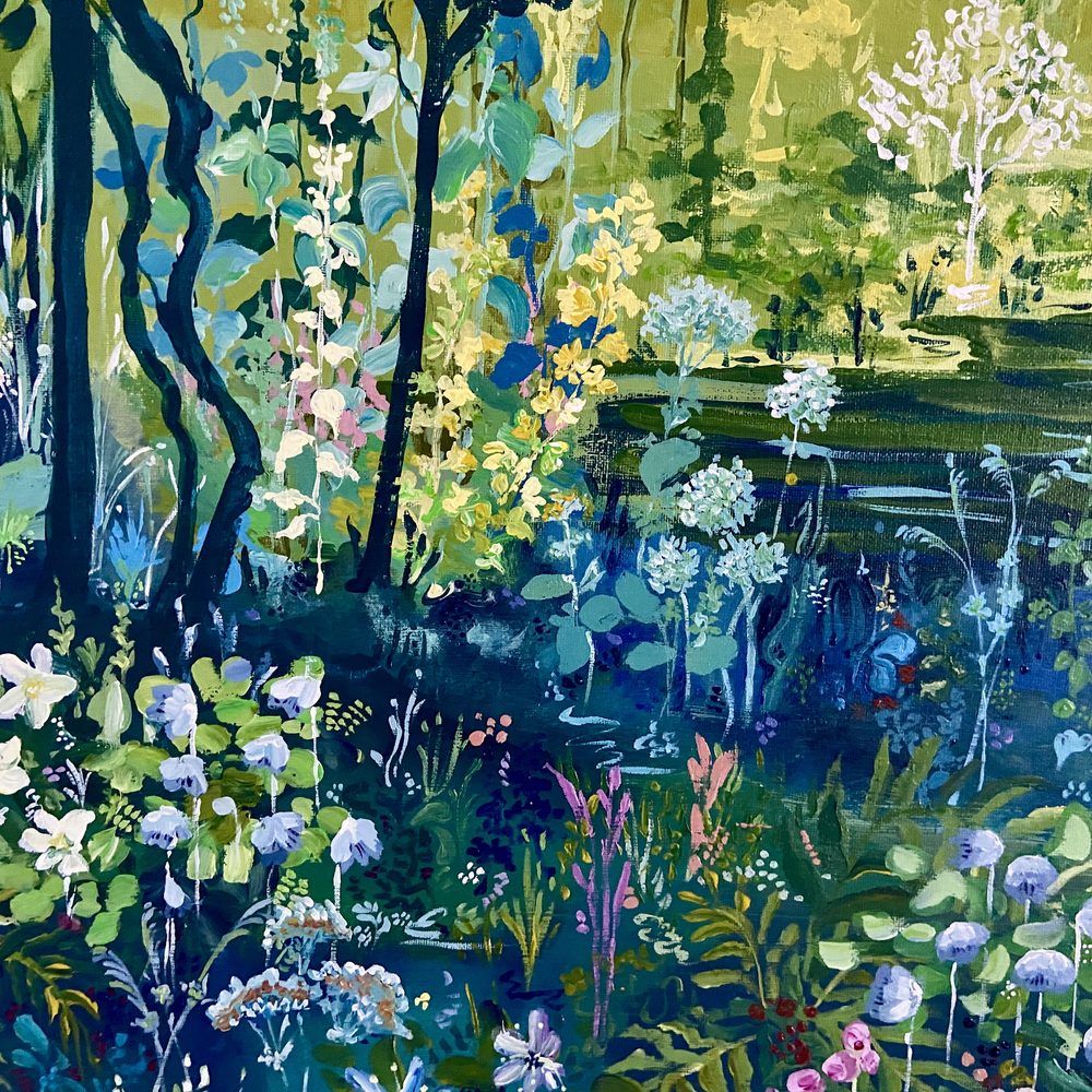 Close-up of dark tree trunks and white wildflowers by the pond in The Forest of Dreams