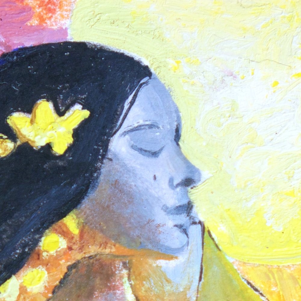 Close-up of her face, eyes closed, with yellow flowers in her hair