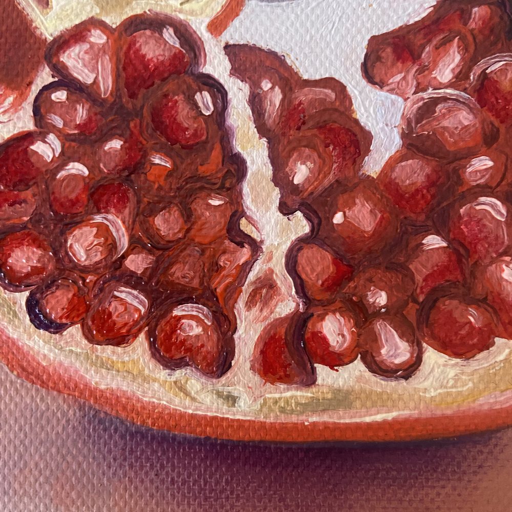 Close-up of the seeds in the cut half, catching the light