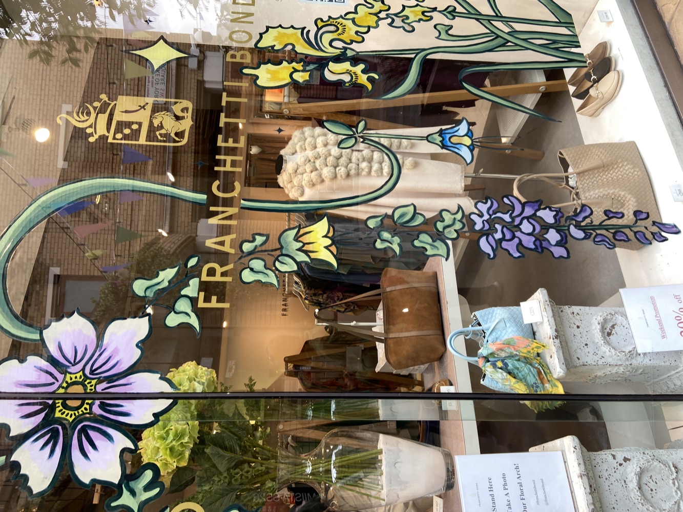 Close-up of the painted wisteria, bellflowers and irises on the right of the window